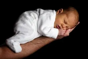 Newborn Baby On An Arm 1080